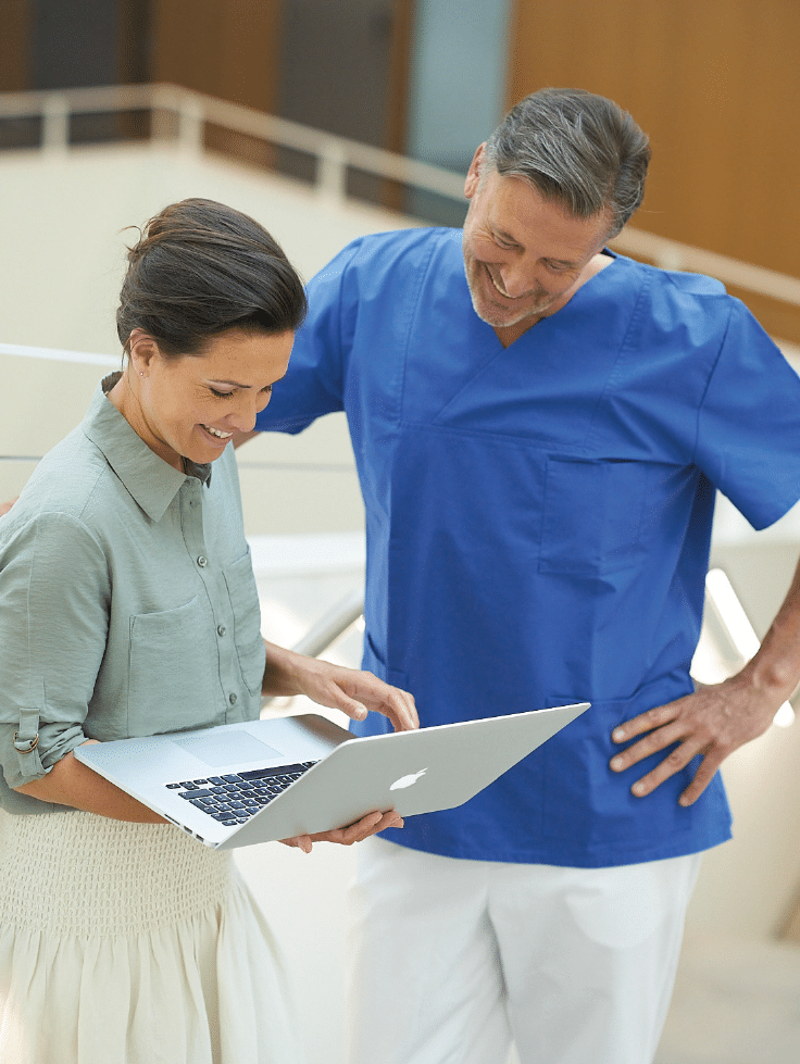 Molecular-Imaging-woman-man-checking-laptop